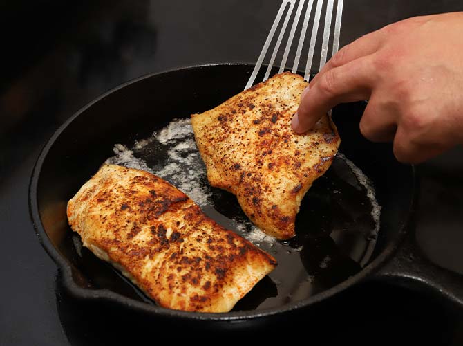 Cooking rockfish in a pan